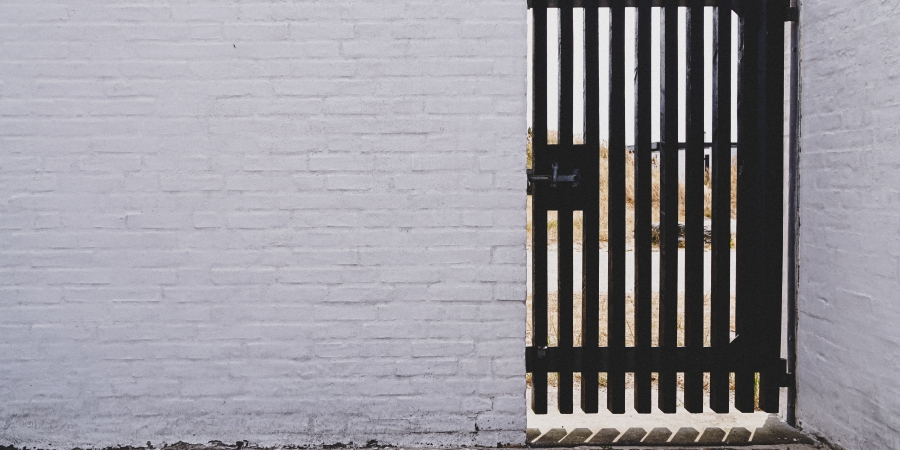 Brick wall with a gate